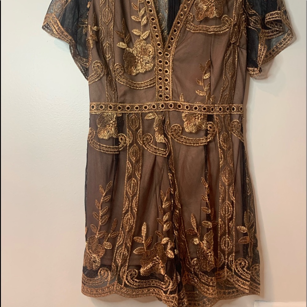 Beautiful gold and black romper